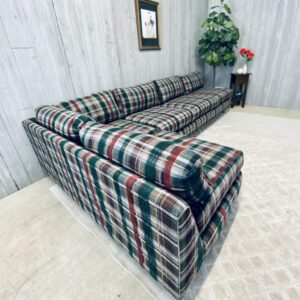 A plaid sectional couch