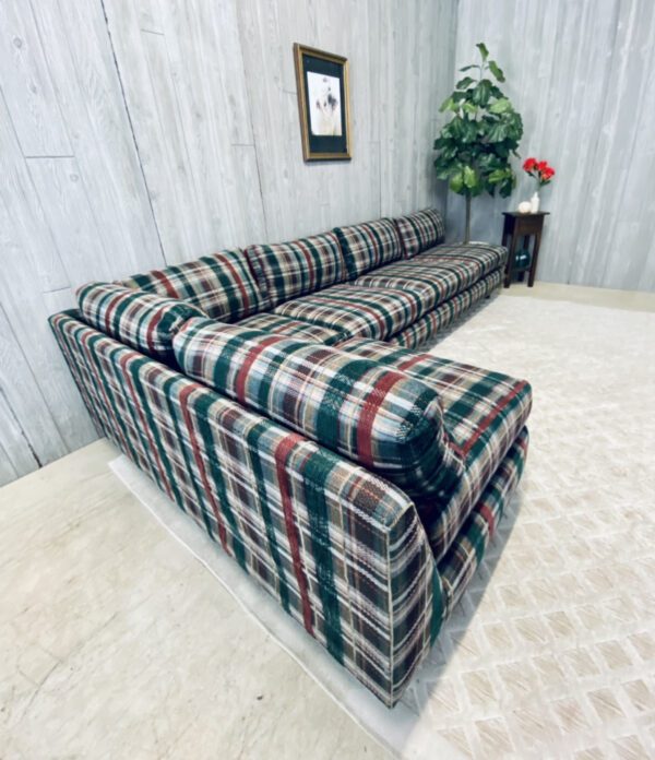 A plaid sectional couch